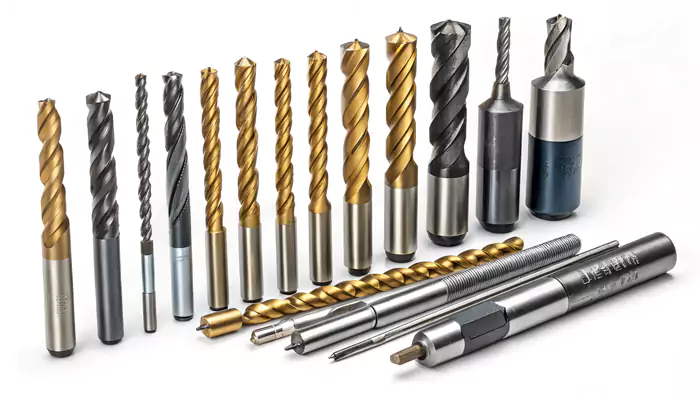 Assortment of various metal drill bits in different sizes and materials