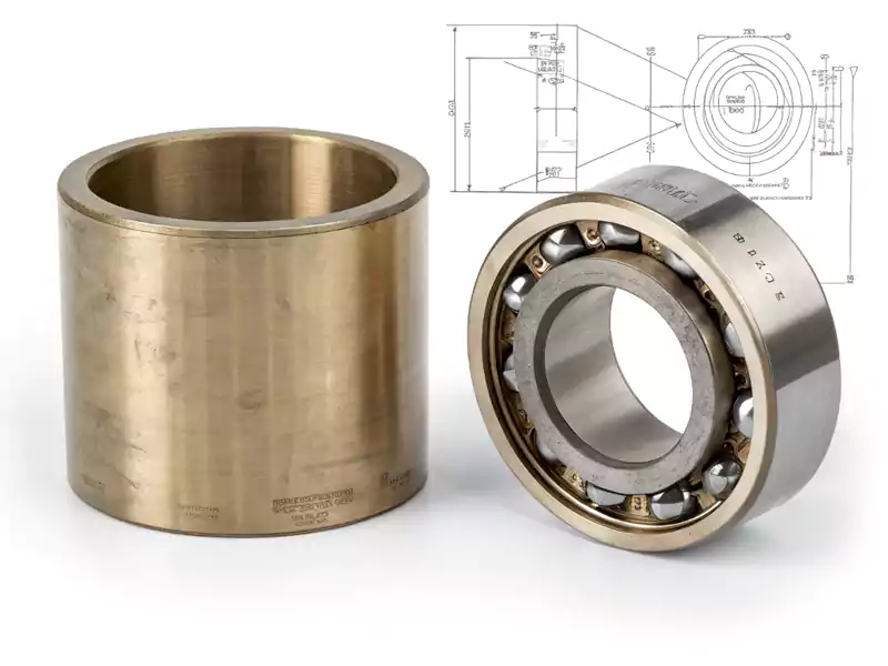 An image comparing a simple bronze sleeve bushing with a complex ball bearing