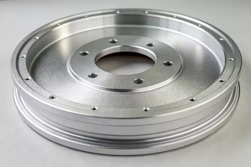A close-up of a satin finish on an aluminum part after glass bead blasting