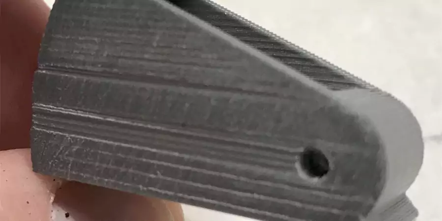 An image showing a close-up of an FDM printed part, highlighting the visible layer lines