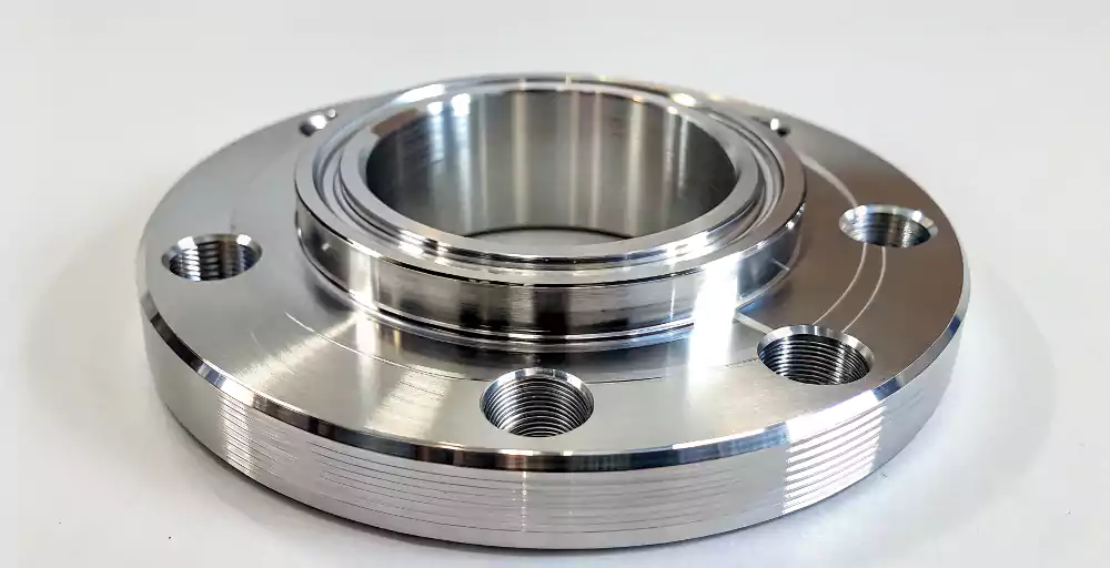 A close-up of a mirror-finish decorative chrome plated part