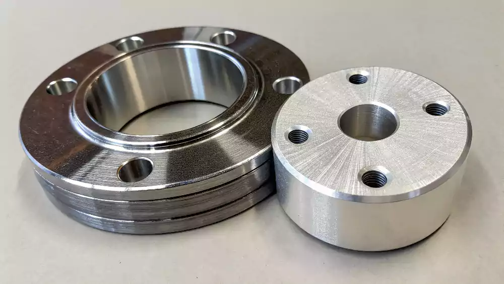 A comparison image showing a shiny decorative chrome part next to a thick, matte-finish hard chrome industrial part