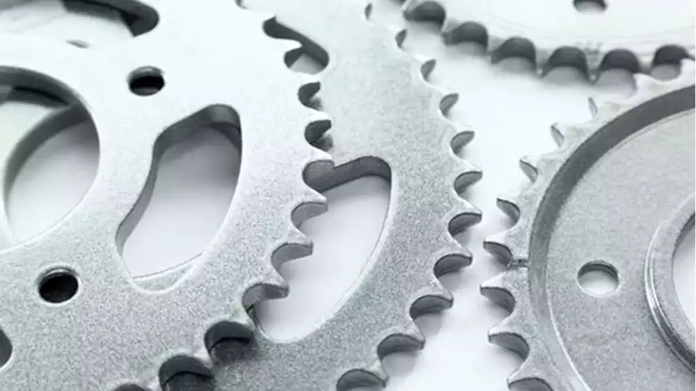A close-up photograph capturing the fine, frosted texture of a bead blasted stainless steel surface