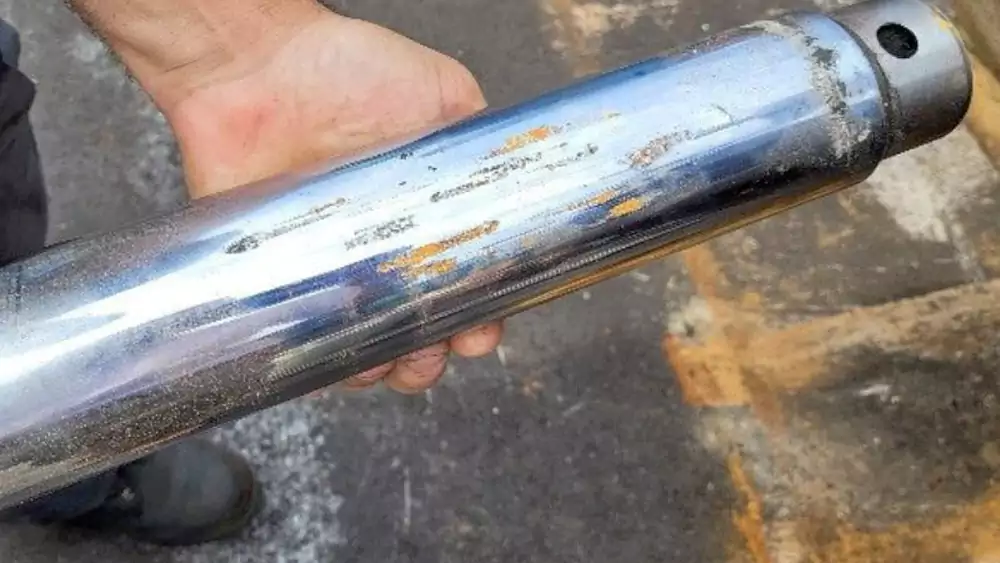 worn hydraulic shaft chrome damage